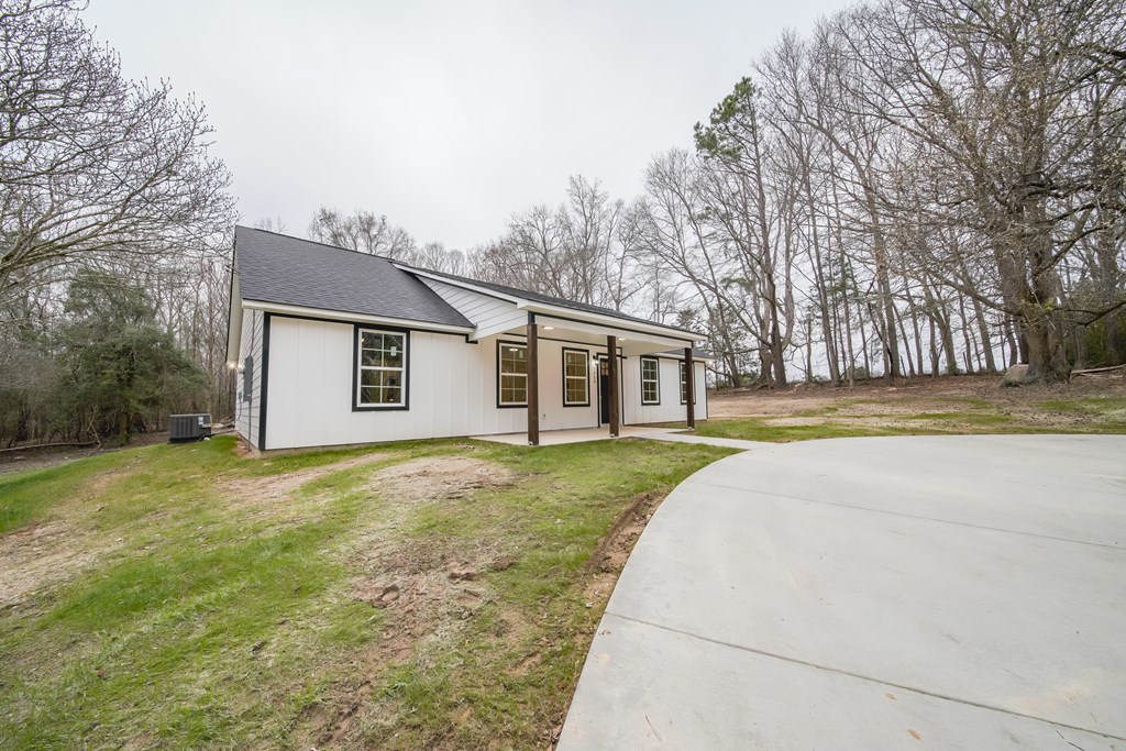 1050 Mt Airy Road Waverly Hall, GA 31831 - Photo 2 of 31 a view of a house with backyard and trees