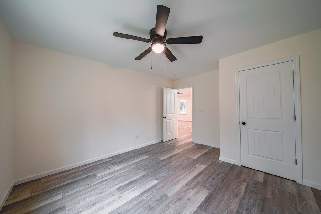 1050 Mt Airy Road Waverly Hall, GA 31831 - Photo 25 of 31 a view of empty room with wooden floor