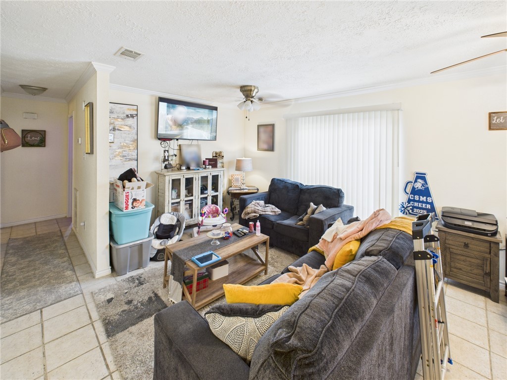 3304 Longleaf Circle College Station, TX 77845 - Photo 4 of 8 a living room with furniture and a flat screen tv