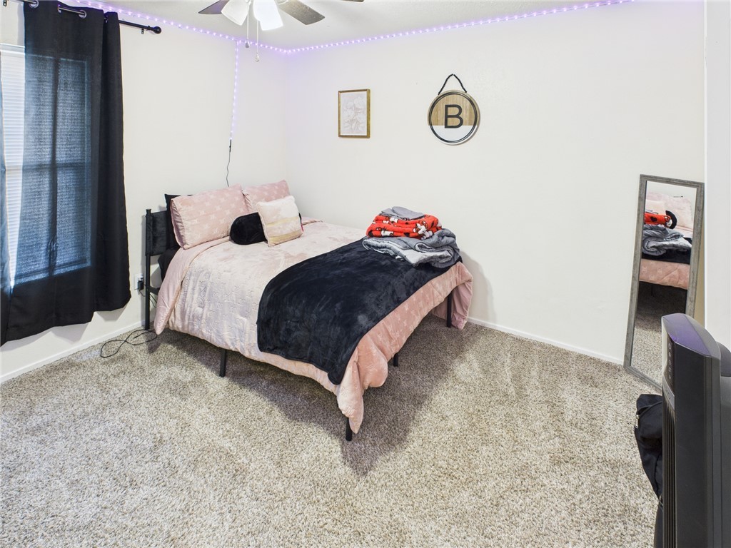 3304 Longleaf Circle College Station, TX 77845 - Photo 5 of 8 a bedroom with a bed and a table in it