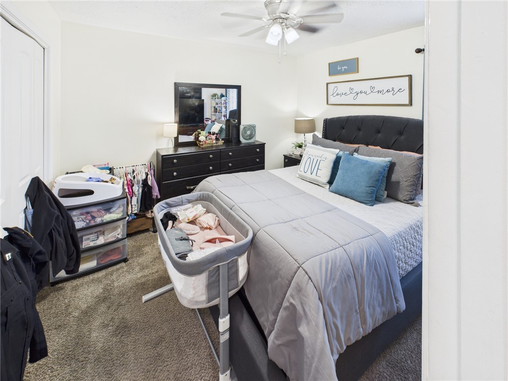 3304 Longleaf Circle College Station, TX 77845 - Photo 7 of 8 a bedroom with a bed mirror and couch