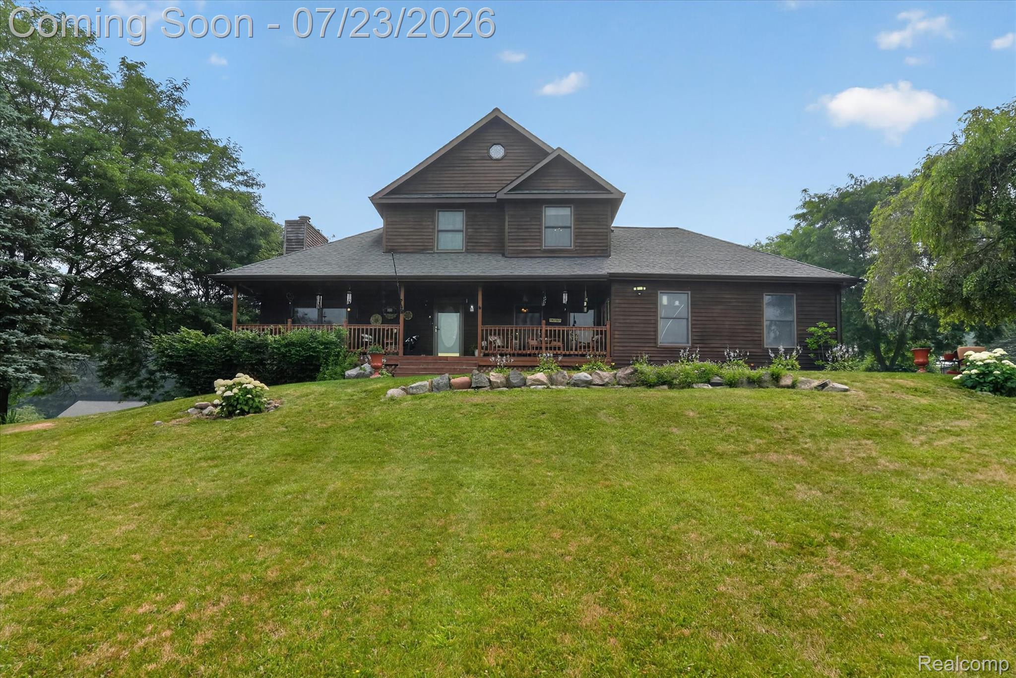 2795 Bird Road Ortonville, MI 48462 - Photo 6 of 62 Two-story property featuring a front porch, wood siding, and gabled roofline
