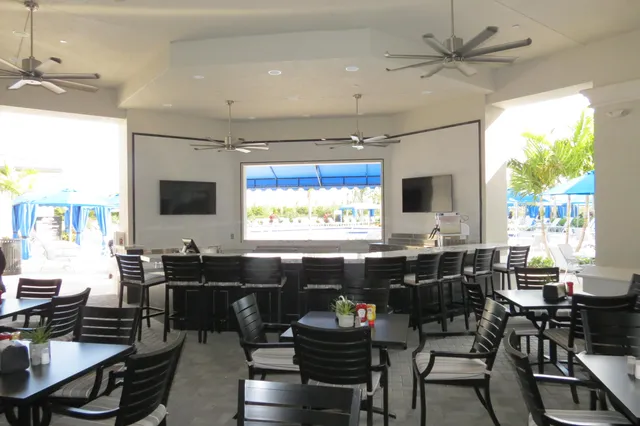 a view of a swimming pool with chairs