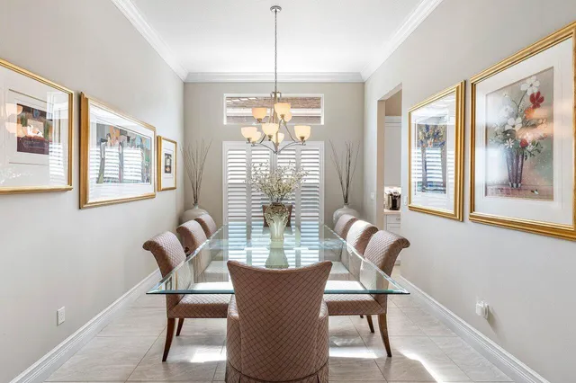 a dining room with furniture and windows