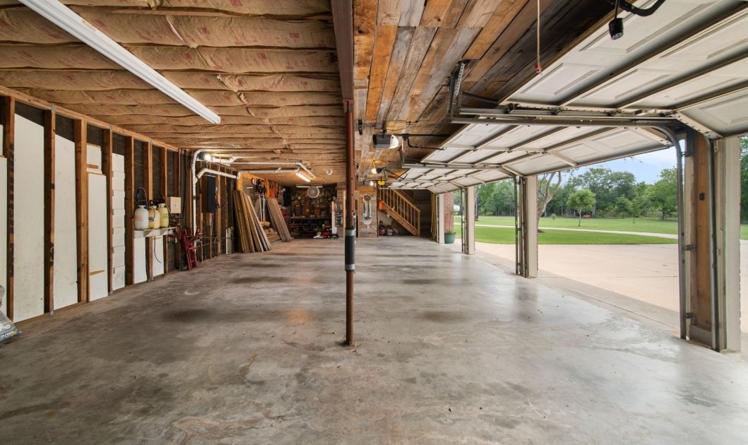 6714 Spray Lane, Unit C699A Rosharon, TX 77583 - Photo 37 of 48 4 Car Detached Oversized Garage with TWO Upstairs Apartments. Lots of Room for a Workshop & Storage.