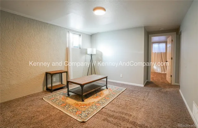 a view of a livingroom with furniture and wooden floor