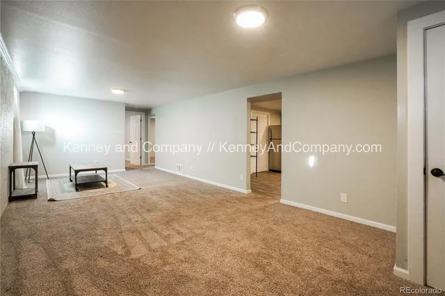 a bedroom with furniture and a rug