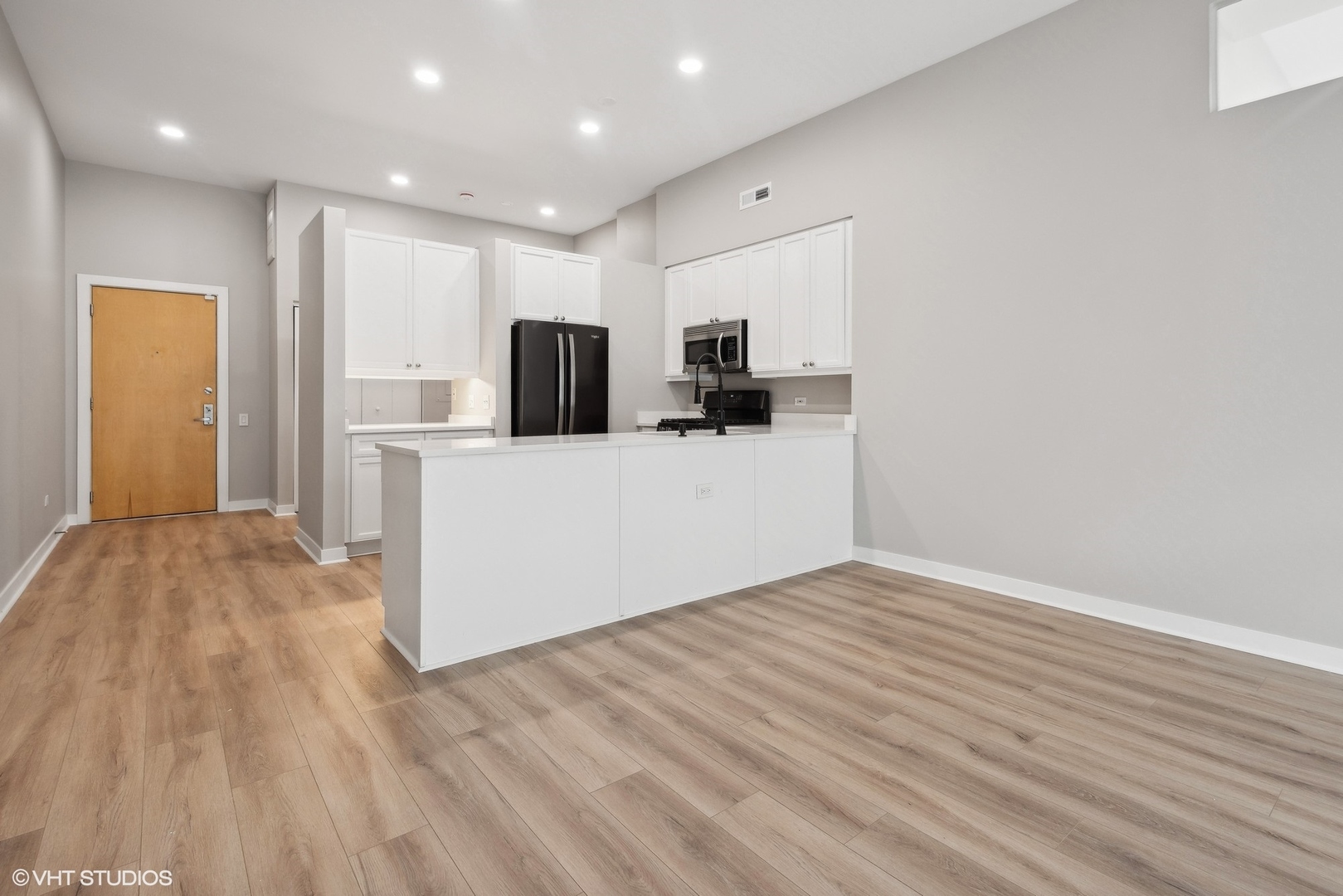 939 West Madison Street, Unit 410 Chicago, IL 60607 - Photo 10 of 23 a view of kitchen with wooden floor