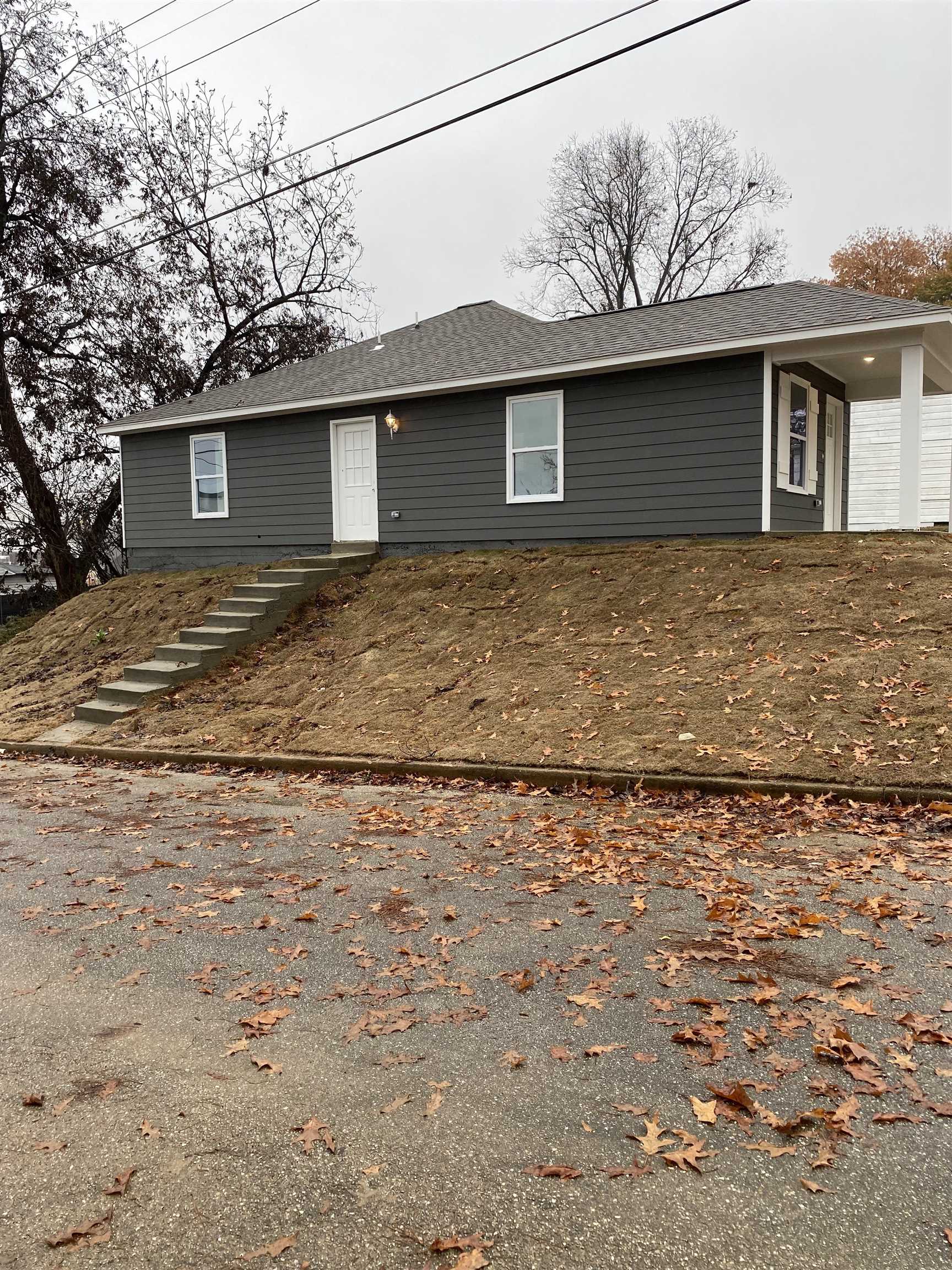 1729 Hanson Road Memphis, TN 38108 - Photo 2 of 12 a front view of a house with garden