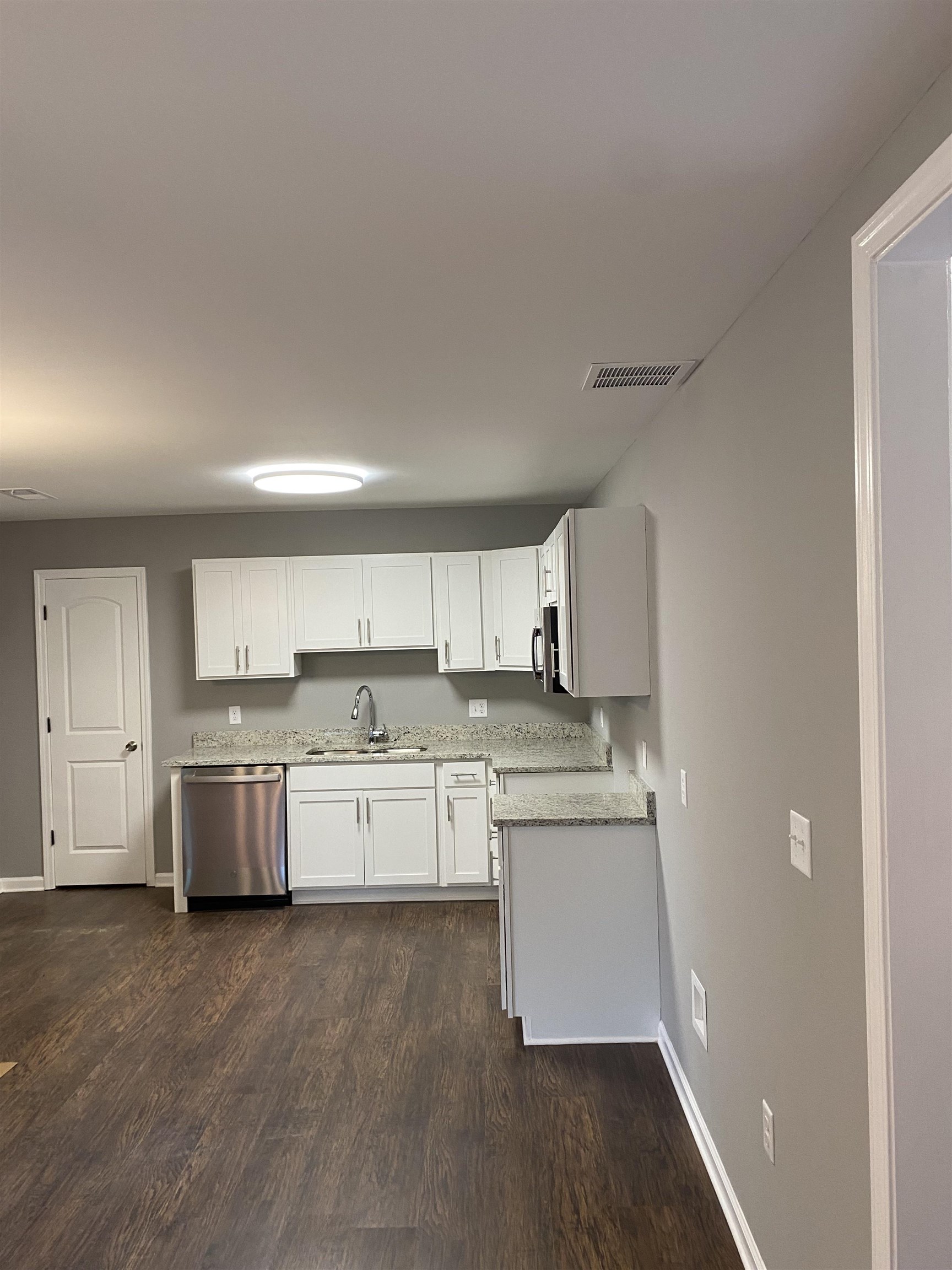 1729 Hanson Road Memphis, TN 38108 - Photo 6 of 12 a kitchen with stainless steel appliances granite countertop a stove and a refrigerator