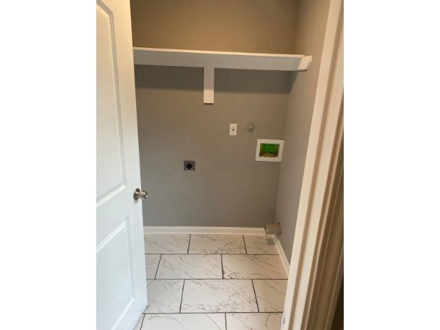 1729 Hanson Road Memphis, TN 38108 - Photo 7 of 12 a bathroom with a glass shower door