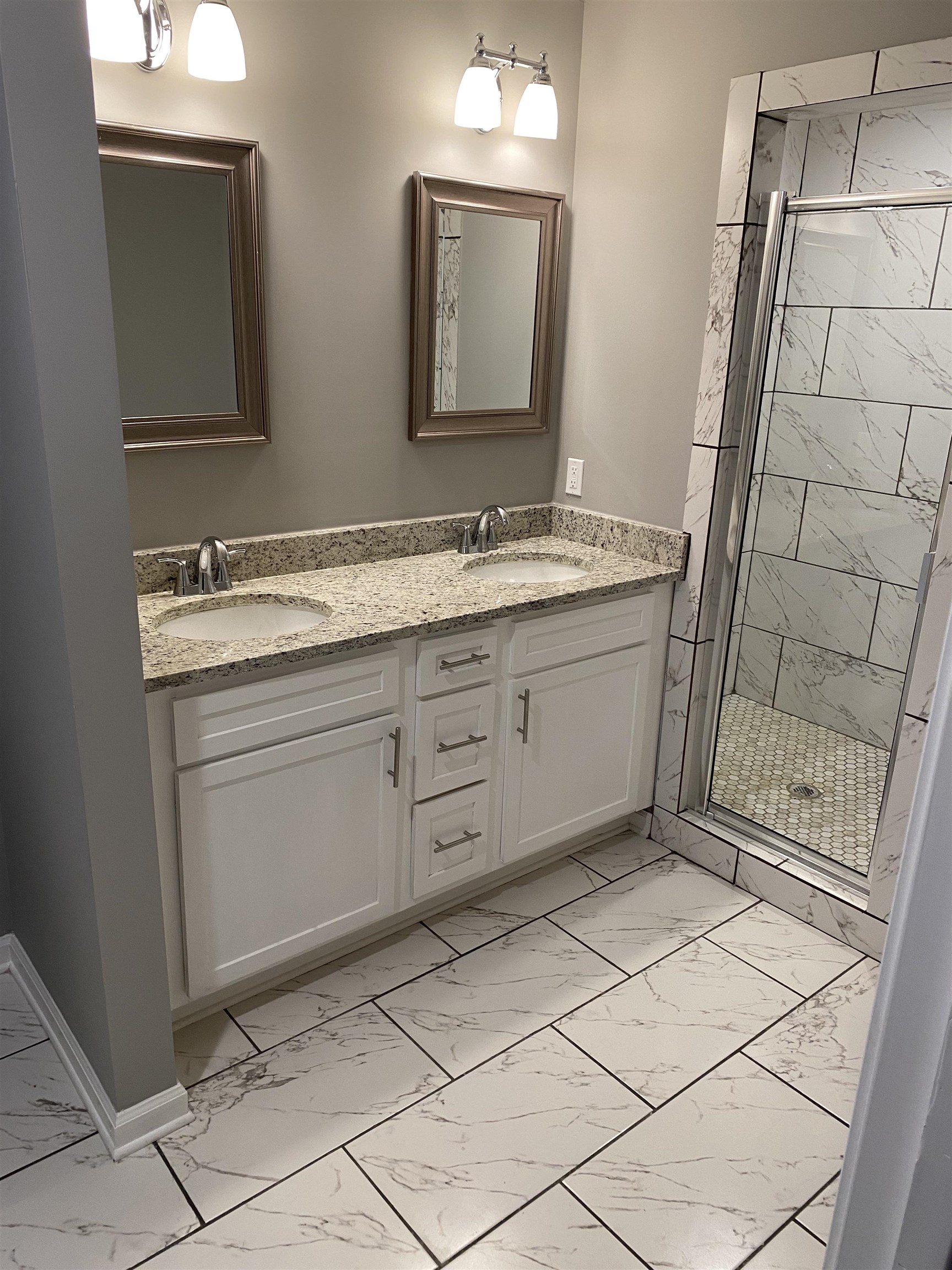 1729 Hanson Road Memphis, TN 38108 - Photo 9 of 12 a bathroom with a sink a vanity and a mirror