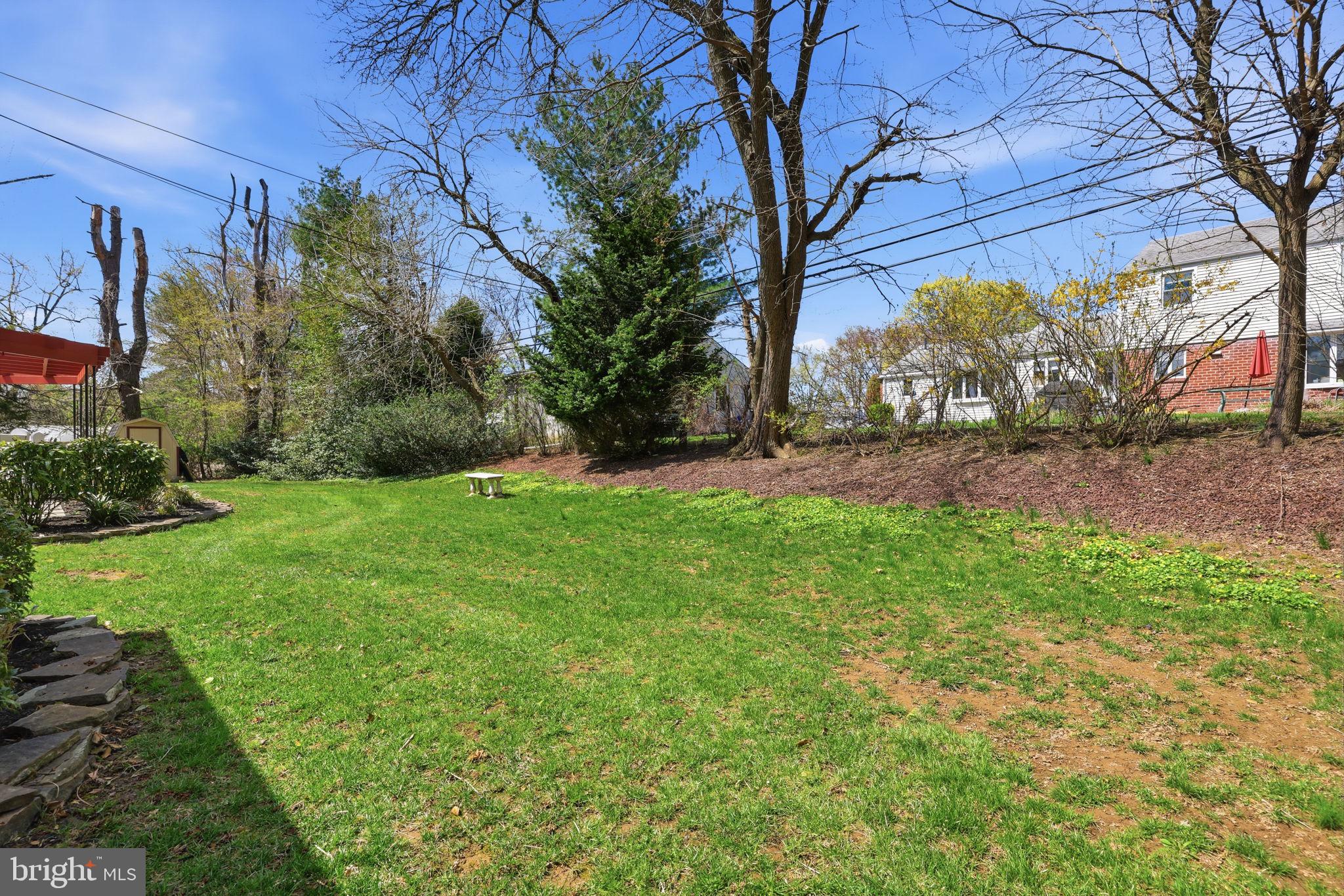 3868 Blake Road Huntingdon Valley, PA 19006 - Photo 38 of 50 a backyard of a house with lots of green space