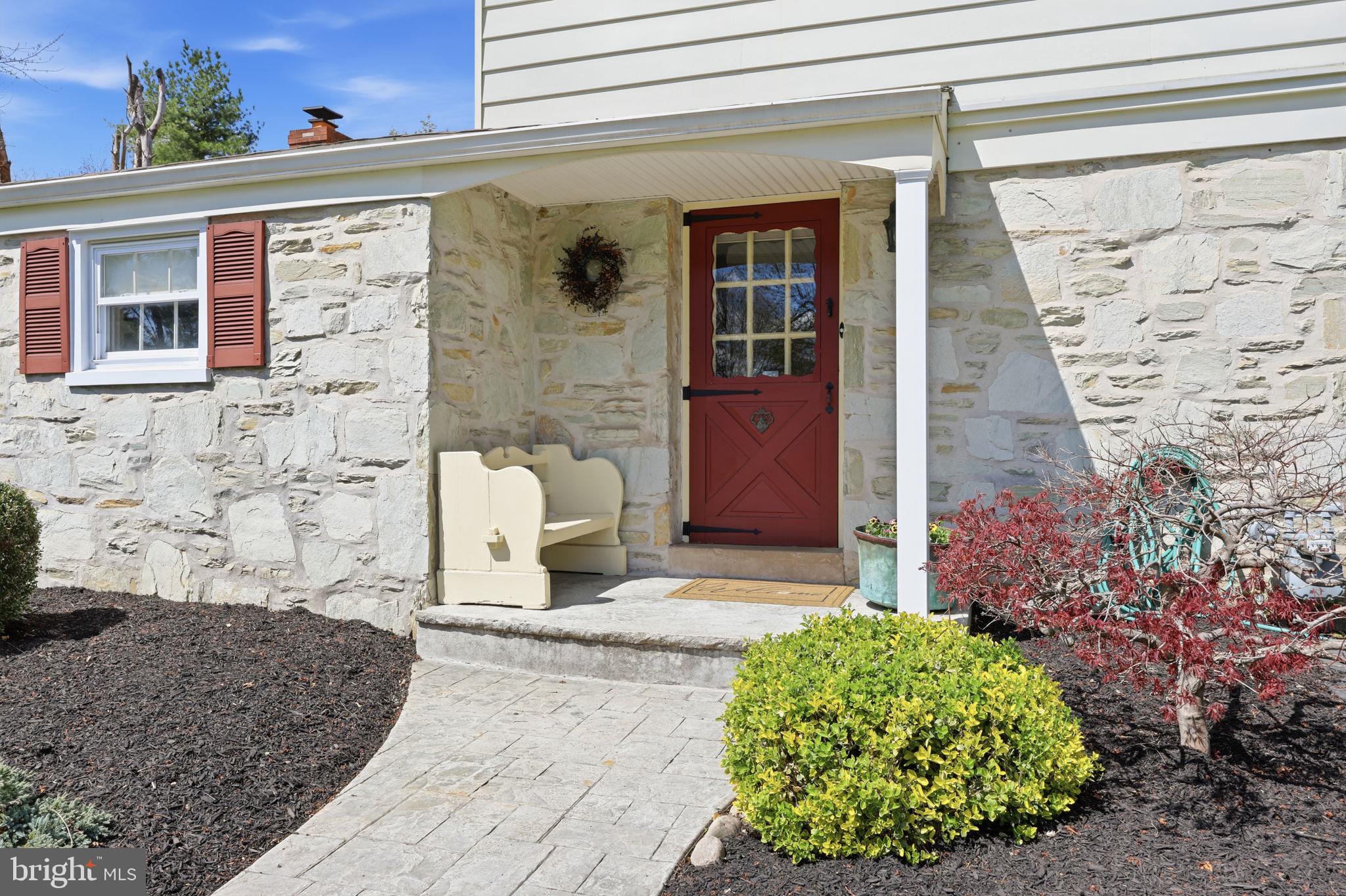 3868 Blake Road Huntingdon Valley, PA 19006 - Photo 5 of 50 a front view of a house with a garden