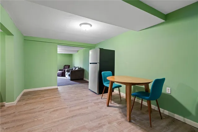 a bedroom with a bed and a chair