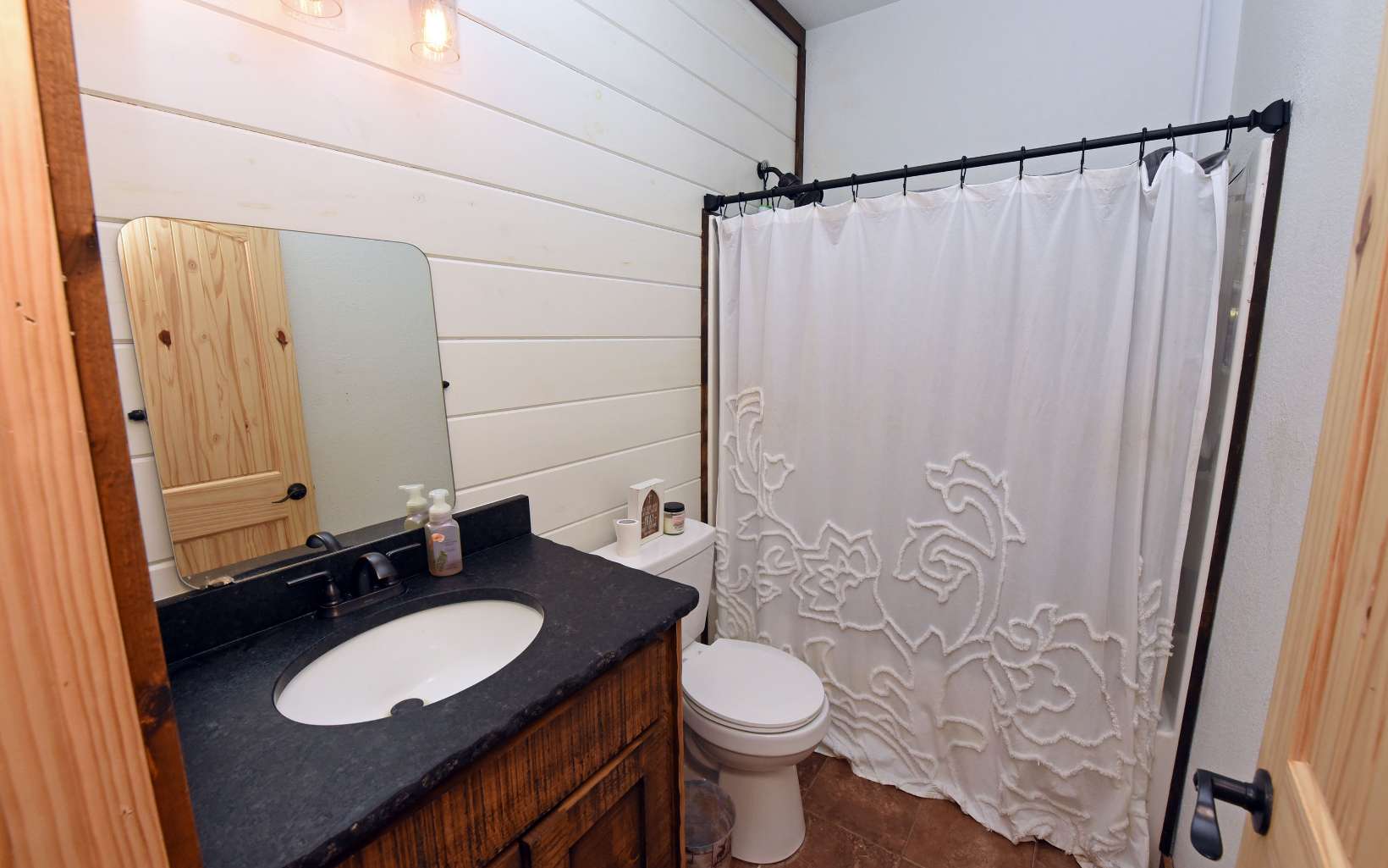 110 Goldfinch Lane Murphy, NC 28906 - Photo 17 of 36 a bathroom with a granite countertop sink toilet and shower