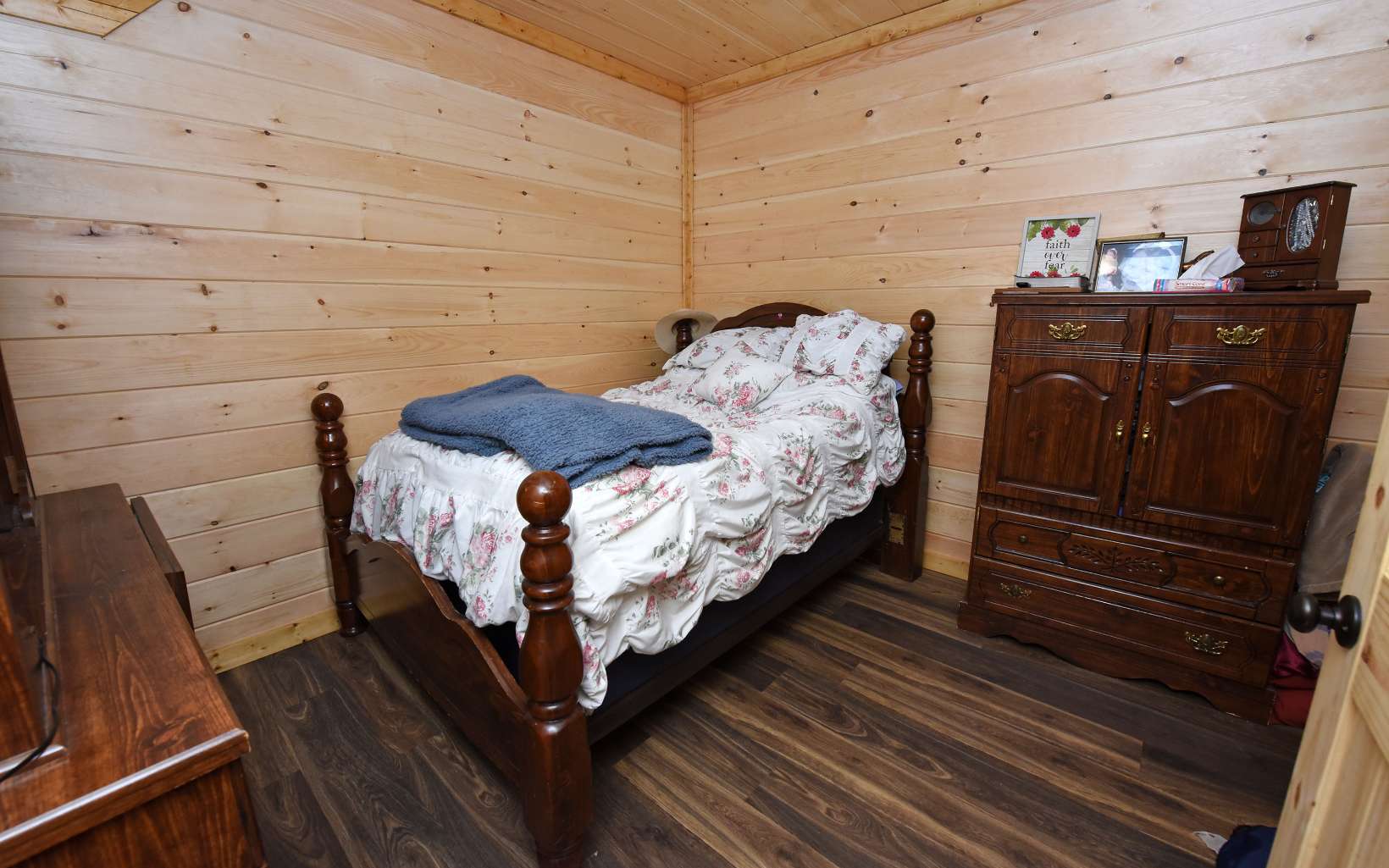 110 Goldfinch Lane Murphy, NC 28906 - Photo 22 of 36 a bed sitting in a bedroom next to a window