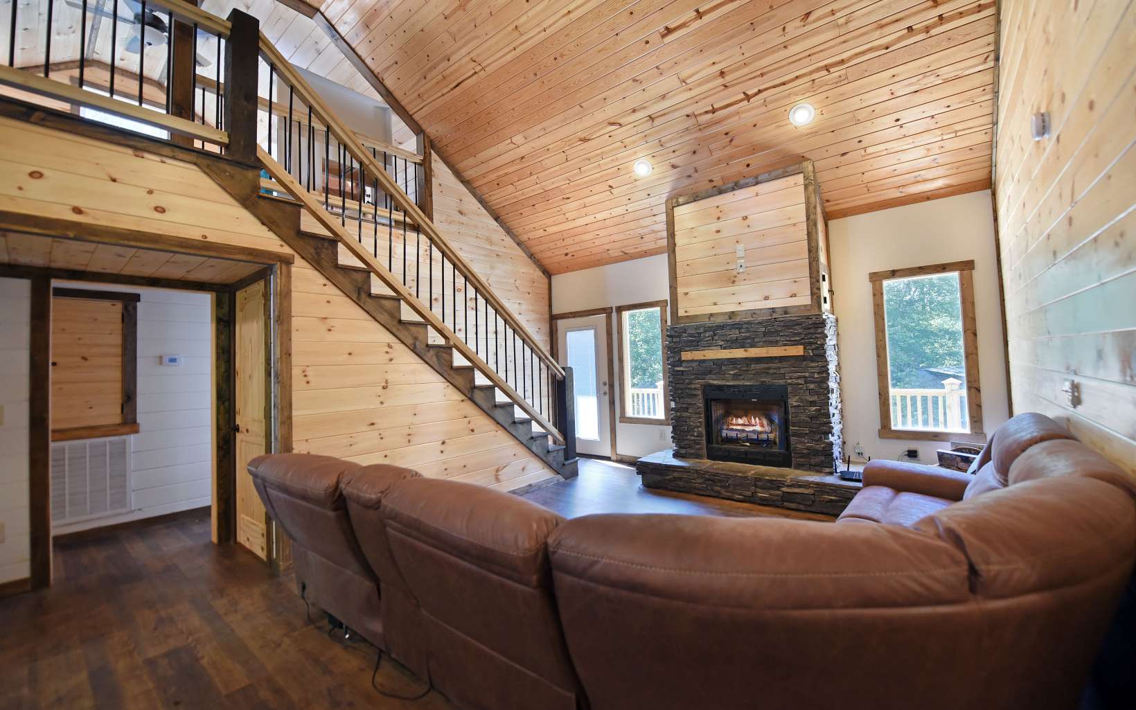 110 Goldfinch Lane Murphy, NC 28906 - Photo 5 of 36 a living room with furniture a fireplace and a large window