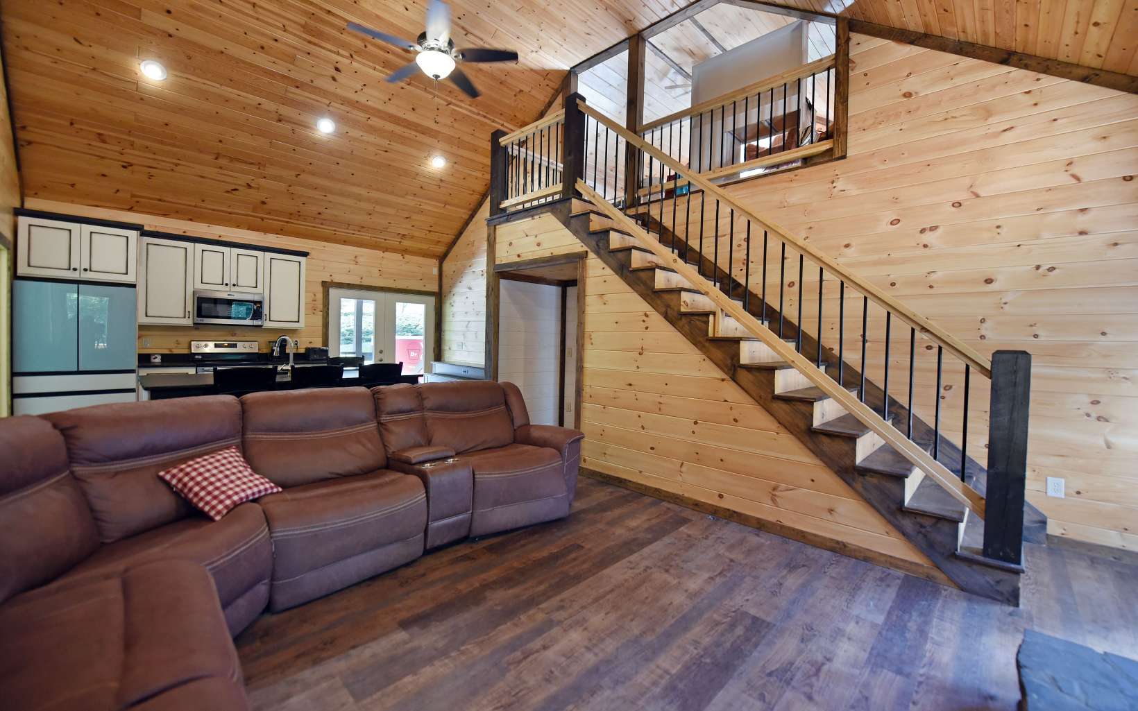 110 Goldfinch Lane Murphy, NC 28906 - Photo 6 of 36 a living room with wooden floors and a ceiling fan