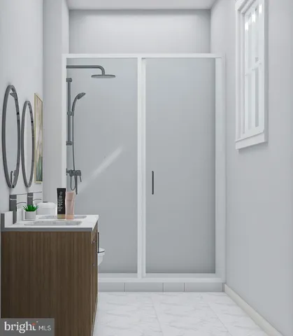 a bathroom with a sink a mirror and shower