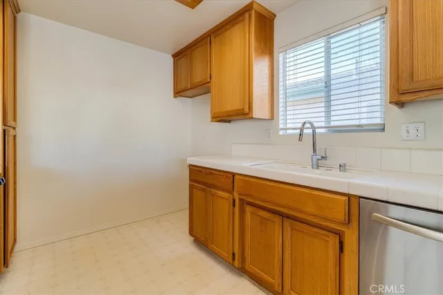 a kitchen with a sink and a window