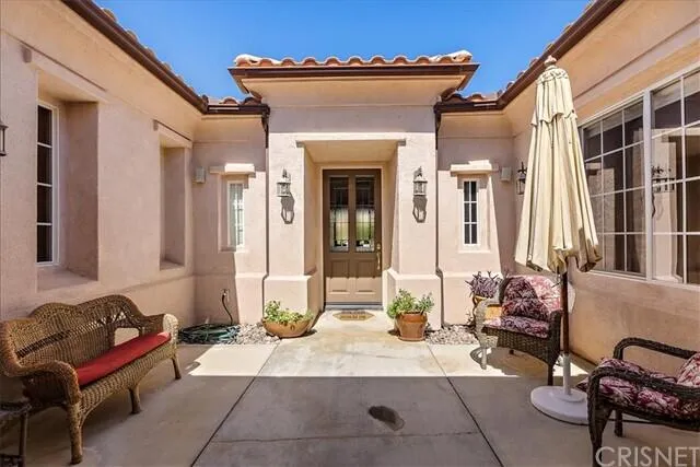 a living room with furniture chess board and a fireplace