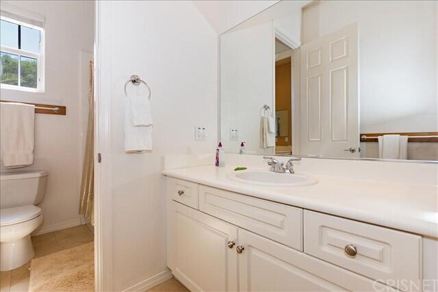 69707 Camino Pacifico Rancho Mirage, CA 92270 - Photo 25 of 38 a bathroom with a sink and a mirror