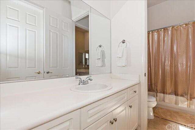 69707 Camino Pacifico Rancho Mirage, CA 92270 - Photo 27 of 38 a bathroom with a sink and a mirror