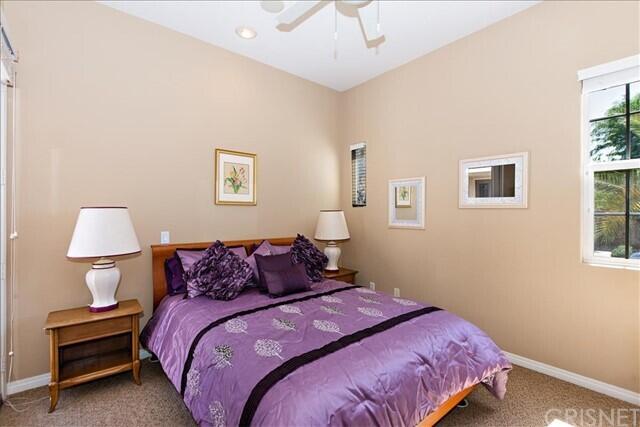 69707 Camino Pacifico Rancho Mirage, CA 92270 - Photo 29 of 38 a bedroom with a bed and a lamp