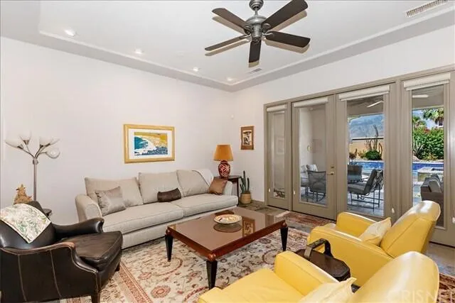 a living room with furniture and a rug