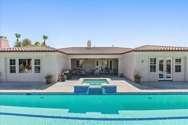 a front view of house with yard and outdoor seating