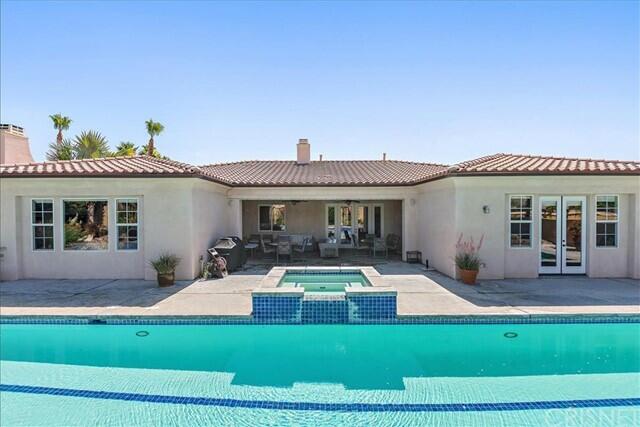 69707 Camino Pacifico Rancho Mirage, CA 92270 - Photo 31 of 38 a front view of a house with a yard