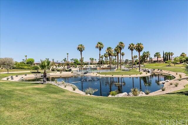 69707 Camino Pacifico Rancho Mirage, CA 92270 - Photo 35 of 38 a view of a swimming pool with outdoor seating