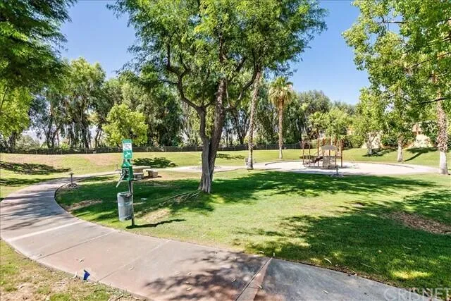 a swimming pool with chairs