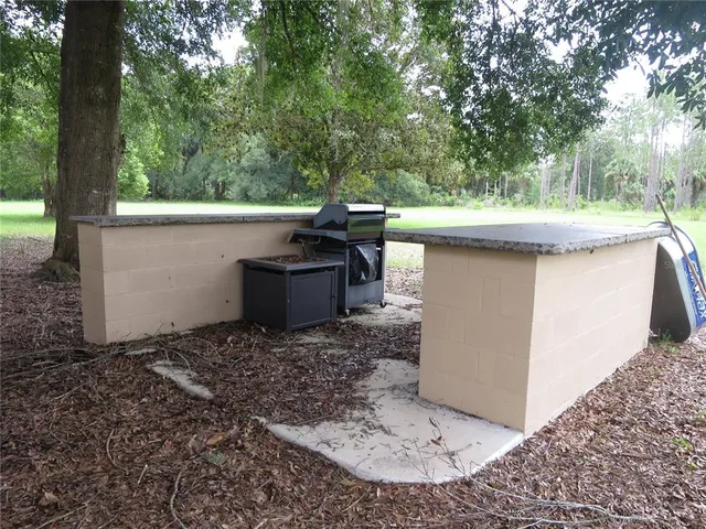 a house that has a big yard with wooden fence