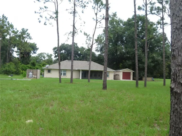 a view of a yard from a balcony