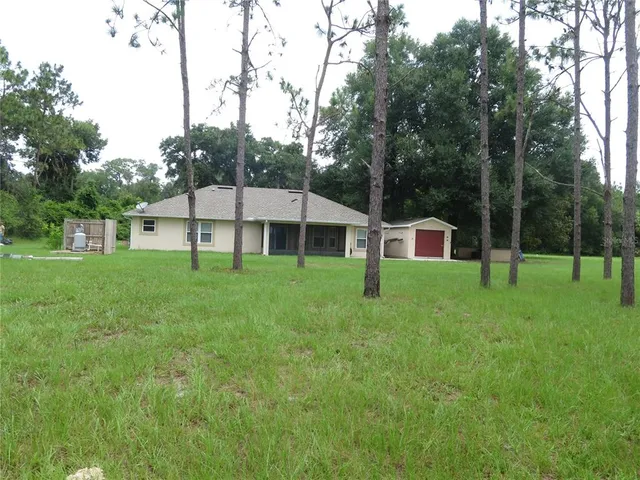 a kitchen with kitchen island stainless steel appliances a sink and cabinets