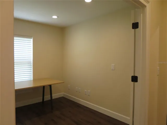 a view of room with window and ceiling fan