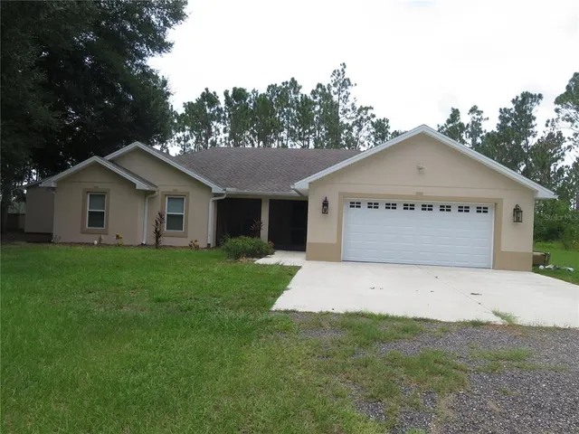 a view of a lake with houses in the back