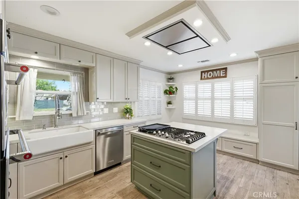 a kitchen with a stove and a sink