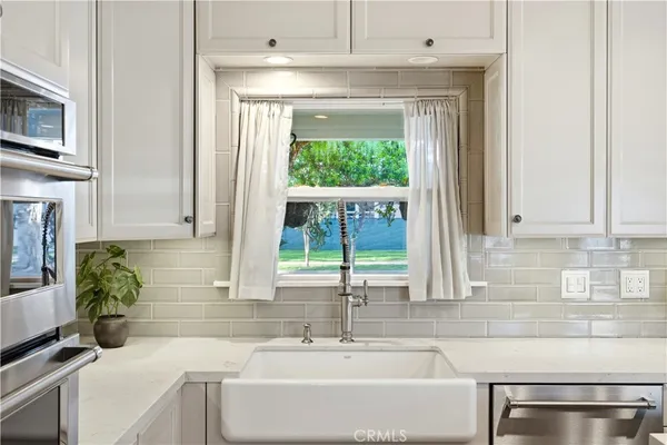 a bathroom with a sink and a window