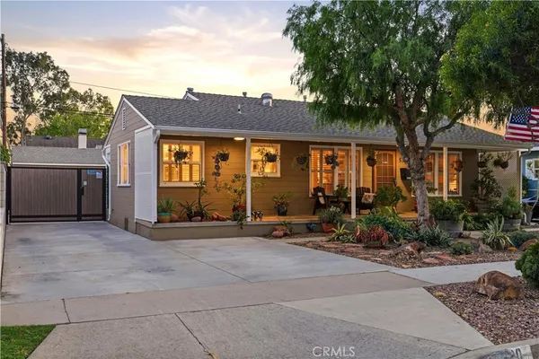 a front view of house with yard outdoor seating and barbeque oven