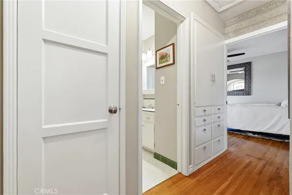 a view of a hallway with wooden floor