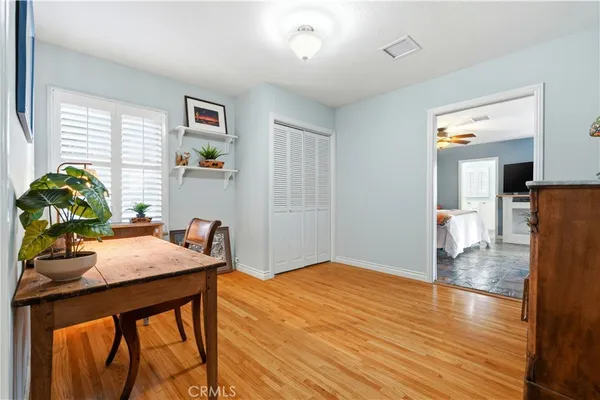 a view of a livingroom with furniture and a kitchen