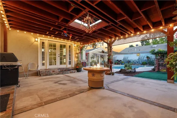 a swimming pool with outdoor seating