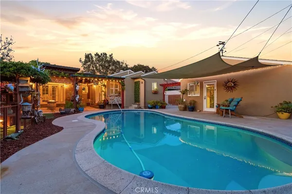 a view of swimming pool with a patio