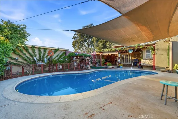a view of a swimming pool with a lounge chairs