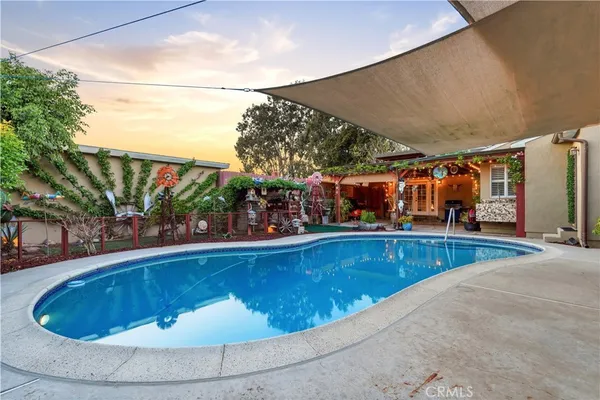 a house with potted plant in front of it