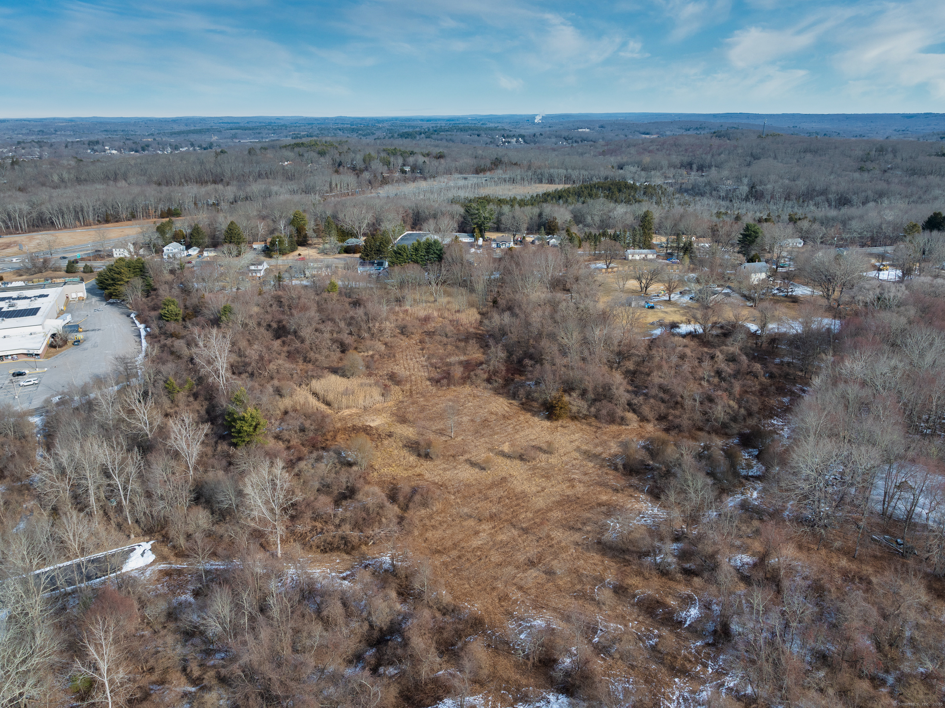 an aerial view of house with mountain view