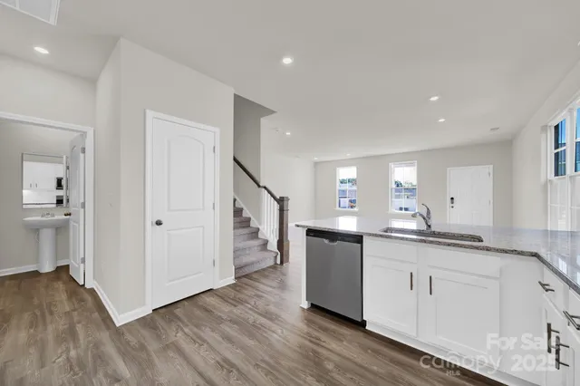 a kitchen with a sink and cabinets